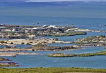 Aerial view of a coastal landscape featuring waterways and islands