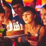Golden Noose Birthday SHOCKER — Minister’s Bold Move Group of friends celebrating a birthday with a cake and drinks