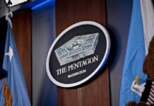 Pentagon Gave $620M to a Startup — 3 Months After Trump Jr. Invested The Pentagon emblem between two flags.