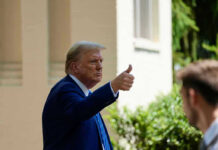 4.2% Inflation — And Trump Says That’s Actually Good News Man in suit giving thumbs up.