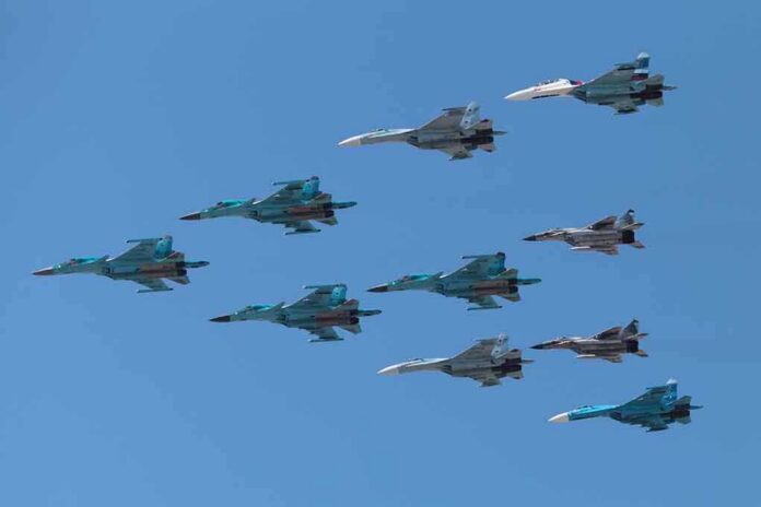 A formation of military jet fighters flying in a clear blue sky
