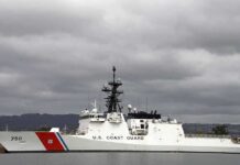 The Sinking Boat That Held 240 People — Coast Guard Arrived Just in Time A U.S. Coast Guard ship docked under cloudy skies