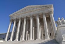 The “Foreign Spy Tool” That’s Been Used on Americans for Years The Supreme Court building featuring grand columns and statues under a clear blue sky