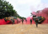 Stalemate Trap Tightens On Kremlin Soldiers running from armored vehicles with red smoke.