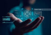 The Music Industry Just Put AI on Notice Hand holding digital AI and ChatGPT graphics.