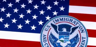 U.S. immigration and customs enforcement seal on American flag
