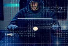 The Phone Scam Network Facing a Federal Sweep Person in hoodie using a laptop with binary code overlay