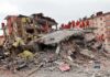 The Venezuela Earthquake — And the Collapse That Made Everything Worse Rescue workers in orange uniforms on a collapsed building site after an earthquake