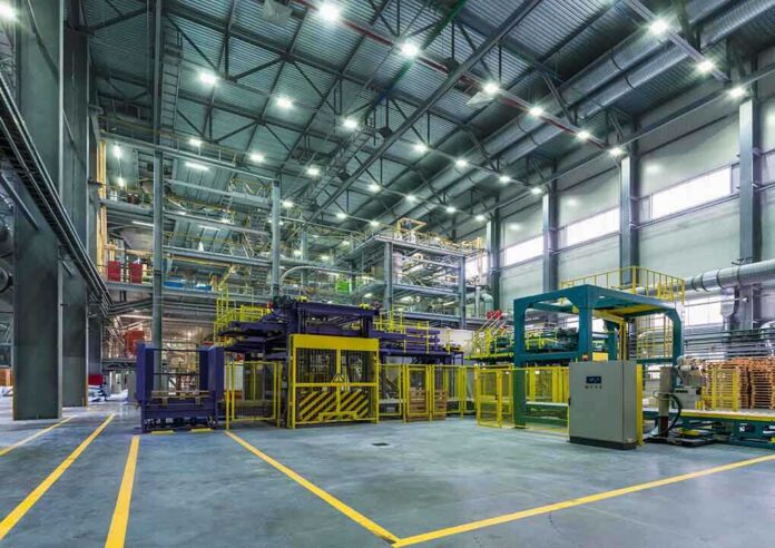 Interior view of a modern industrial facility with manufacturing equipment