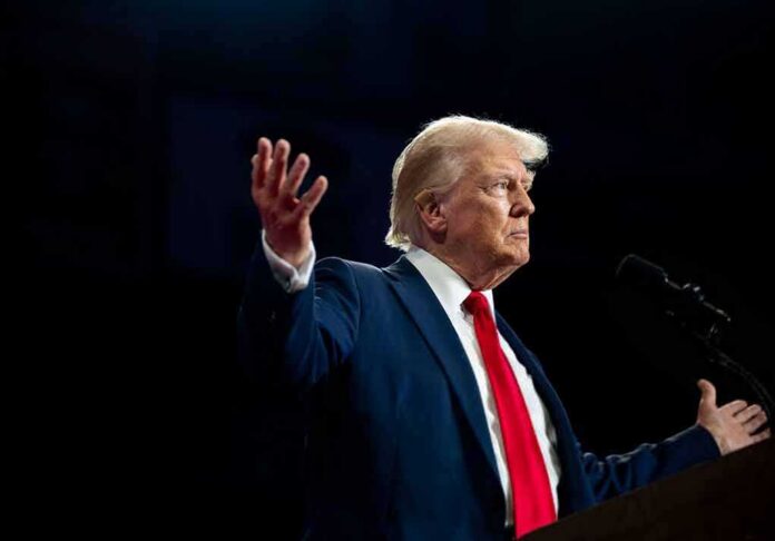 shutterstock_2512443159 A man in a suit gesturing during a speech