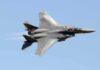 fighter jet banking in clear sky