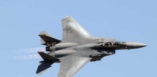fighter jet banking in clear sky