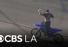 Brazen Dirt Bike Taunts Cops, Then Refuels LAPD pursuit ends as officers take dirt bike riding suspect, allegedly armed, into custody