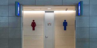 Public restroom entrance with male and female symbols