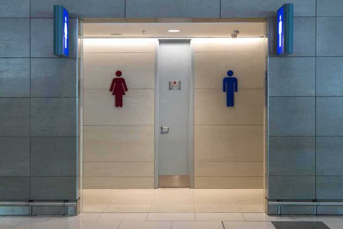 shutterstock_1063324622 Public restroom entrance with male and female symbols
