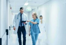 Doctors Miss This Antidepressant Pitfall Doctors walking in a hospital corridor reviewing a tablet
