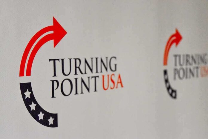Turning Point USA logo on a backdrop