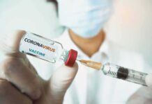 Fox Anchor’s Heart Scare After Vaccination Boosters Healthcare worker holds a COVID-19 vaccine vial and syringe