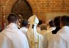 Rome Tightens Screws On Improvisers Bishop in white mitre among clergy during church procession