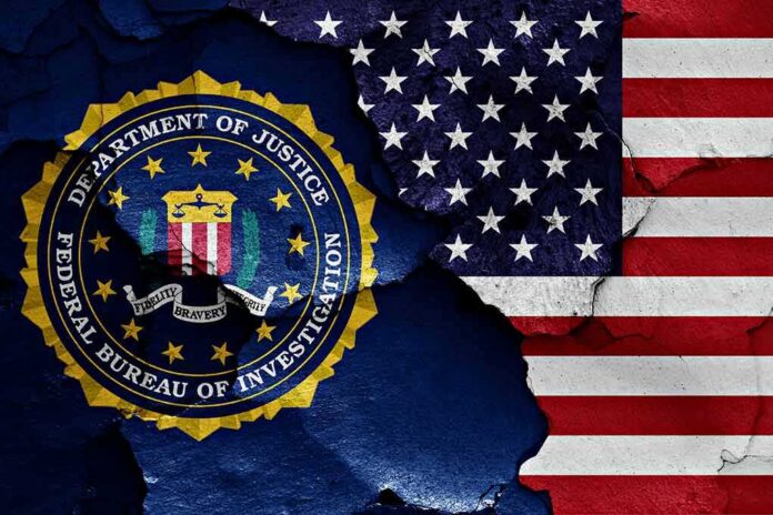 shutterstock_1023380488-1 FBI seal and American flag on cracked wall