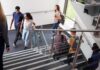Campus Panic Surges – Law Built It This Way Students walking on a school staircase