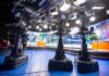 television studio with cameras on pedestals facing news desk