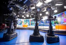 TV Bombshell: Trump Dragged Into FBI Talk television studio with cameras on pedestals facing news desk