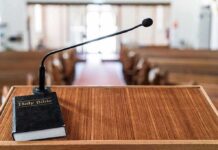 They Dug Up What This Pastor Said About Beef Podium with microphone and Bible in a church