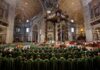 Jonathan Cyprien among clergy during a mass in a grand cathedral interior