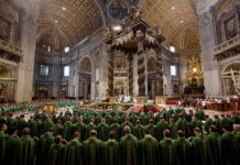 Jonathan Cyprien among clergy during a mass in a grand cathedral interior