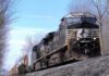 Freight train locomotive on a wooded track