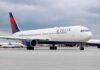 Delta Air Lines passenger jet taxiing on airport tarmac