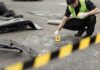 Parking-Lot Ambush Stuns Gay Nightlife Forensic investigator marking evidence at crash scene