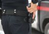 Father Pulls Gun And Community Demands Action Officer gripping a holstered handgun on a duty belt