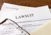 One Man Wanted Dozens Of U.S. Born Children Legal documents labeled lawsuit on a desk