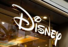 Disney store sign with illuminated script logo