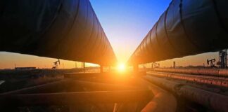 Industrial pipelines at sunset