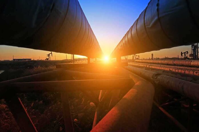 shutterstock_749826562 Industrial pipelines at sunset