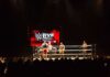 Apollo Crews in a WWE ring during a live wrestling match