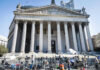 Charged With Rape, On Track For Badge Reporters and photographers gathered outside a neoclassical courthouse