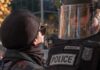 Metal Barricades, Hot Mics – Then The Push protester faces police officer in riot gear