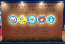 $220M Ad Deal Triggers Federal Heat U.S. Department of Defense display wall with service seals