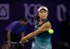 tennis player hitting a backhand shot