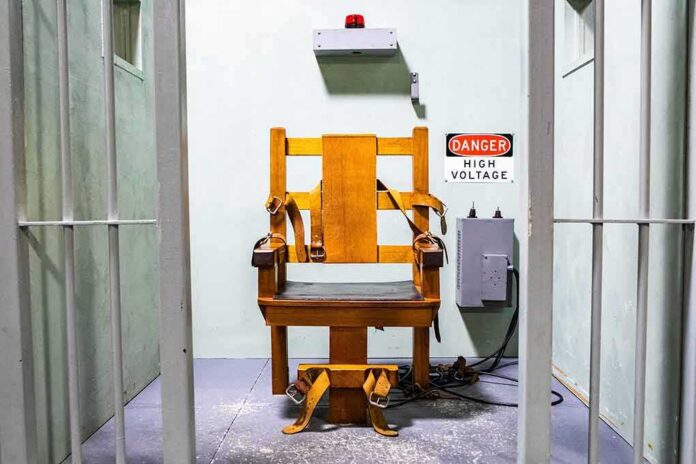 shutterstock_1949928943 electric chair in a prison execution chamber