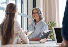 Tenant Aid Dollars – Stunning Discrepancy Emerges Smiling woman with gray hair talking in a modern office