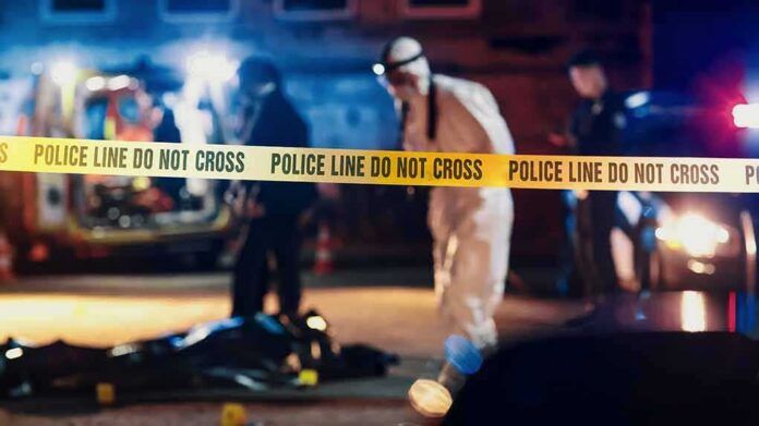 shutterstock_2230644519-1 Police tape at nighttime crime scene