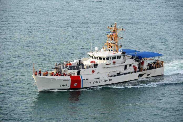 shutterstock_419363122-1 U.S. Coast Guard patrol boat cruising at sea