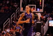 Brittney Griner running on a basketball court during a game